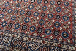 Close-up detail of 1950s Varamin rug from Iran / Persia showing Wool weave