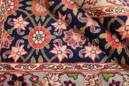 Corner detail of 1980s Varamin rug showing border pattern and Wool pile