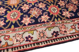 Backside of handmade 1980s Varamin rug showing knot structure and weave density
