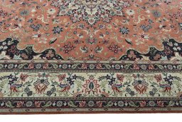 Corner detail of 2000s Yazd rug showing border pattern and Wool pile