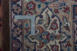 Backside of handmade 1970s Yazd rug showing knot structure and weave density
