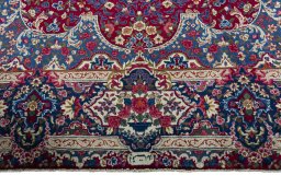 Full view of 1970s Yazd rug from Iran / Persia, 354 × 253 cm in Red tones