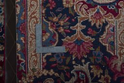 Backside of handmade 1970s Yazd rug showing knot structure and weave density