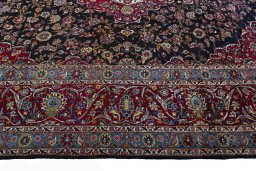 Corner detail of 2000s Yazd rug showing border pattern and Wool pile