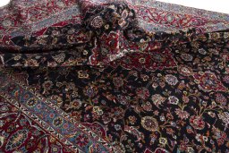 Surface texture of 2000s Yazd rug with natural Wool and intricate pattern
