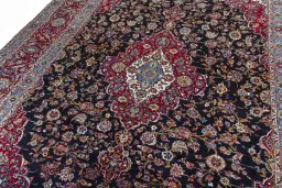 Backside of handmade 2000s Yazd rug showing knot structure and weave density