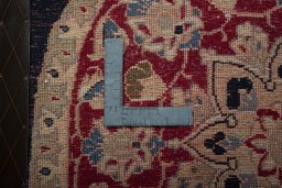 Backside of handmade 2000s Yazd rug showing knot structure and weave density