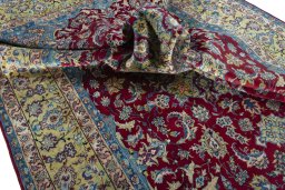 Surface texture of 2000s Yazd rug with natural Wool and intricate pattern