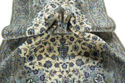 Surface texture of 2000s Kashan rug with natural Wool and intricate pattern