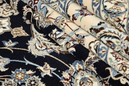Corner detail of New Nain 6La with Silk rug showing border pattern and Wool pile
