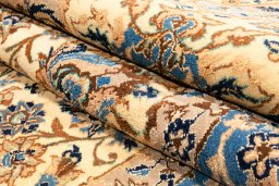 Backside of handmade New Nain 6La with Silk rug showing knot structure and weave density