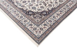 Corner detail of New Nain 6La with Silk rug showing border pattern and Wool pile