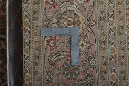 Backside of handmade New Tabriz 50/60/70 Raj rug showing knot structure and weave density