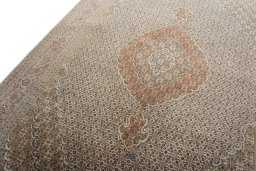 Backside of handmade New Tabriz 50/60/70 Raj rug showing knot structure and weave density