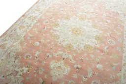 Backside of handmade New Tabriz 50/60/70 Raj rug showing knot structure and weave density