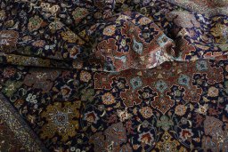 Backside of handmade 1970s Tabriz 50/60/70 Raj rug showing knot structure and weave density