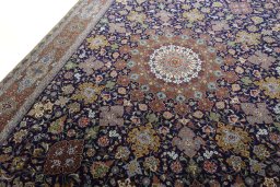 Backside of handmade 1970s Tabriz 50/60/70 Raj rug showing knot structure and weave density