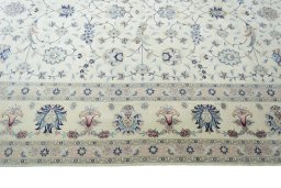Corner detail of New Tabriz 50/60/70 Raj rug showing border pattern and Cork pile