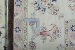 Backside of handmade New Tabriz 50/60/70 Raj rug showing knot structure and weave density