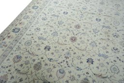 Backside of handmade New Tabriz 50/60/70 Raj rug showing knot structure and weave density
