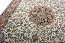 Backside of handmade New Tabriz 50/60/70 Raj rug showing knot structure and weave density