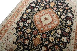 Backside of handmade New Tabriz 50/60/70 Raj rug showing knot structure and weave density