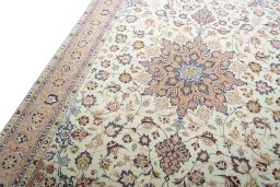Backside of handmade New Tabriz 50/60/70 Raj rug showing knot structure and weave density
