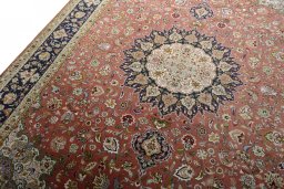 Backside of handmade New Tabriz 50/60/70 Raj rug showing knot structure and weave density