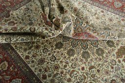 Backside of handmade New Tabriz 50/60/70 Raj rug showing knot structure and weave density