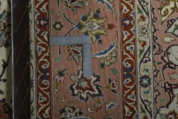 Backside of handmade New Tabriz 50/60/70 Raj rug showing knot structure and weave density