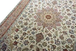 Backside of handmade New Tabriz 50/60/70 Raj rug showing knot structure and weave density