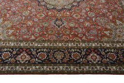 Corner detail of New Tabriz 50/60/70 Raj rug showing border pattern and Cork pile