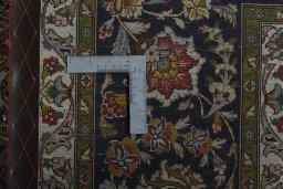 Backside of handmade New Tabriz 50/60/70 Raj rug showing knot structure and weave density