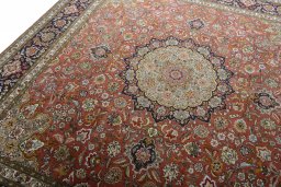 Backside of handmade New Tabriz 50/60/70 Raj rug showing knot structure and weave density