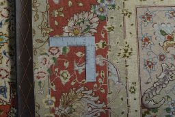 Backside of handmade New Tabriz 50/60/70 Raj rug showing knot structure and weave density