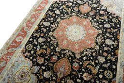 Backside of handmade New Tabriz 50/60/70 Raj rug showing knot structure and weave density