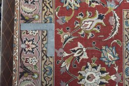 Backside of handmade New Tabriz 50/60/70 Raj rug showing knot structure and weave density
