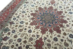 Backside of handmade New Tabriz 50/60/70 Raj rug showing knot structure and weave density