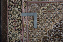 Backside of handmade New Tabriz 50/60/70 Raj rug showing knot structure and weave density