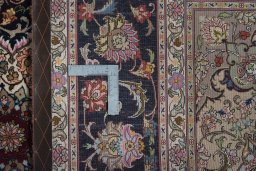 Backside of handmade New Tabriz 50/60/70 Raj rug showing knot structure and weave density