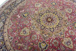 Backside of handmade New Tabriz 50/60/70 Raj rug showing knot structure and weave density