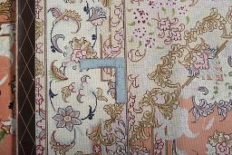 Backside of handmade New Tabriz 50/60/70 Raj rug showing knot structure and weave density