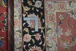 Backside of handmade New Tabriz 50/60/70 Raj rug showing knot structure and weave density