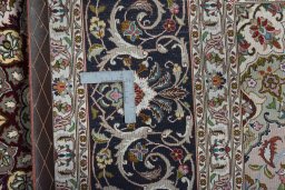 Backside of handmade New Tabriz 50/60/70 Raj rug showing knot structure and weave density