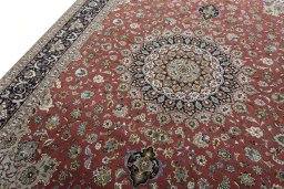 Backside of handmade New Tabriz 50/60/70 Raj rug showing knot structure and weave density