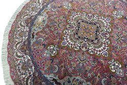 Backside of handmade New Tabriz 50/60/70 Raj rug showing knot structure and weave density
