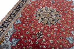 Backside of handmade New Tabriz 50/60/70 Raj rug showing knot structure and weave density