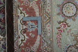 Backside of handmade New Tabriz 50/60/70 Raj rug showing knot structure and weave density