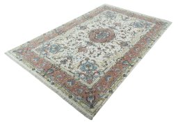 Corner detail of New Tabriz 50/60/70 Raj rug showing border pattern and Cork pile