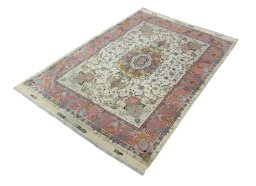 Corner detail of 2000s Tabriz 50/60/70 Raj rug showing border pattern and Cork pile